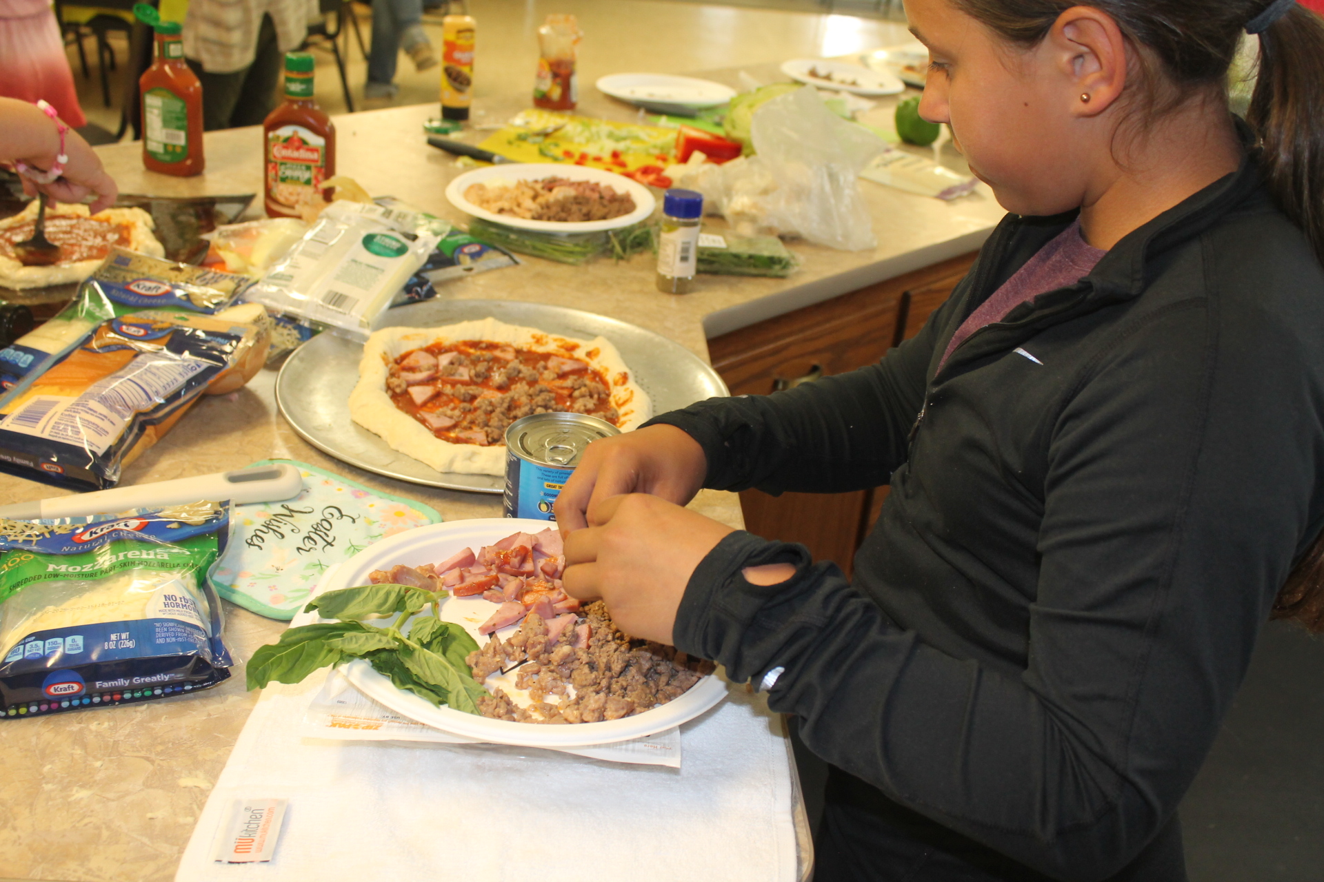 4-H Member Prepares Ingredients for Her Pizza